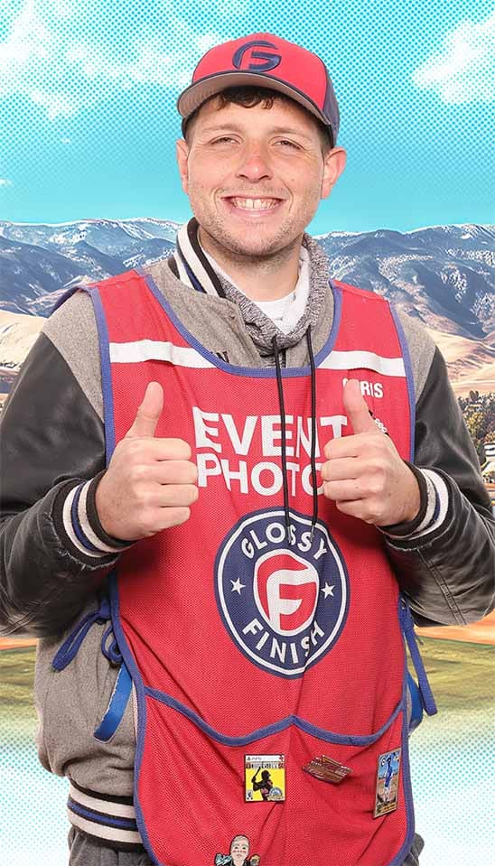 Chris T. giving two thumbs up in his Glossy Finish event photos vest