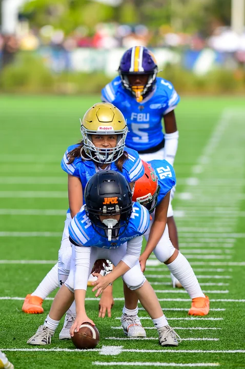 Center snapping the ball to the quarterback