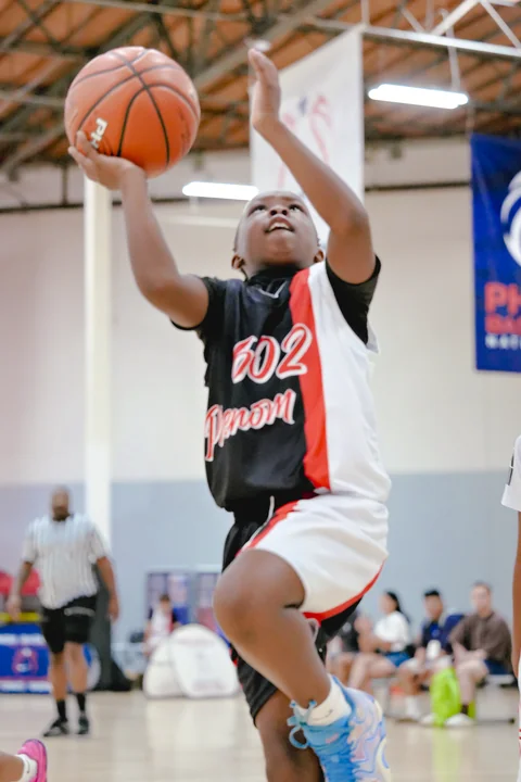Young player rising for a layup