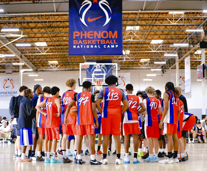 Teams huddled under the Phenom Basketball National Camp banner